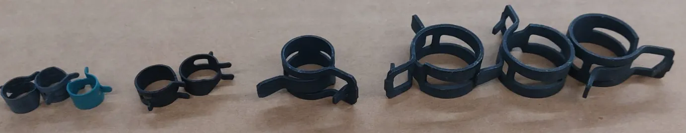 Constant tension spring band clamps in several sizes